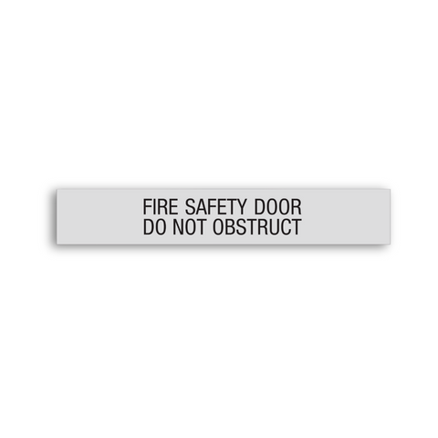 a FIRE SAFETY DOOR/DO NOT OBSTRUCT sign