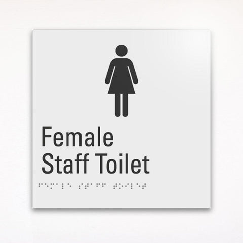 a gray braille toilet sign saying female staff toilet