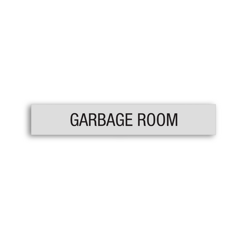 a gray Garbage Room sign