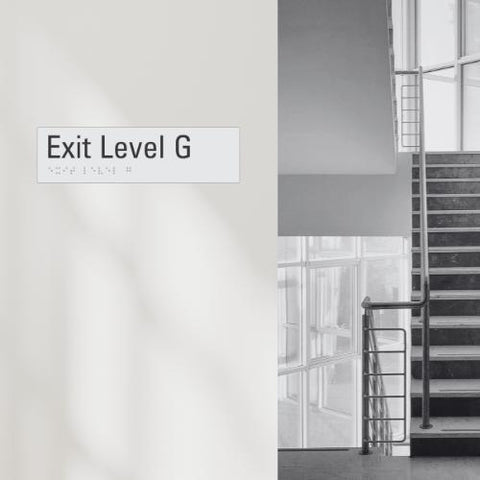 an exit level G sign (with braille element) next to a staircase