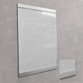 A large white rectangular wall sign or display board with a slim silver frame, mounted on a textured gray wall.