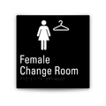 A square black sign with white graphics and text reading 'Female Change Room,' including a female figure icon, a hanger icon, and Braille text near the bottom, shown on a light gray background.