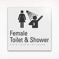 a gray braille toilet sign saying Female Toilet and Shower